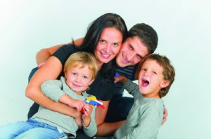 portrait of happy young family with two sons